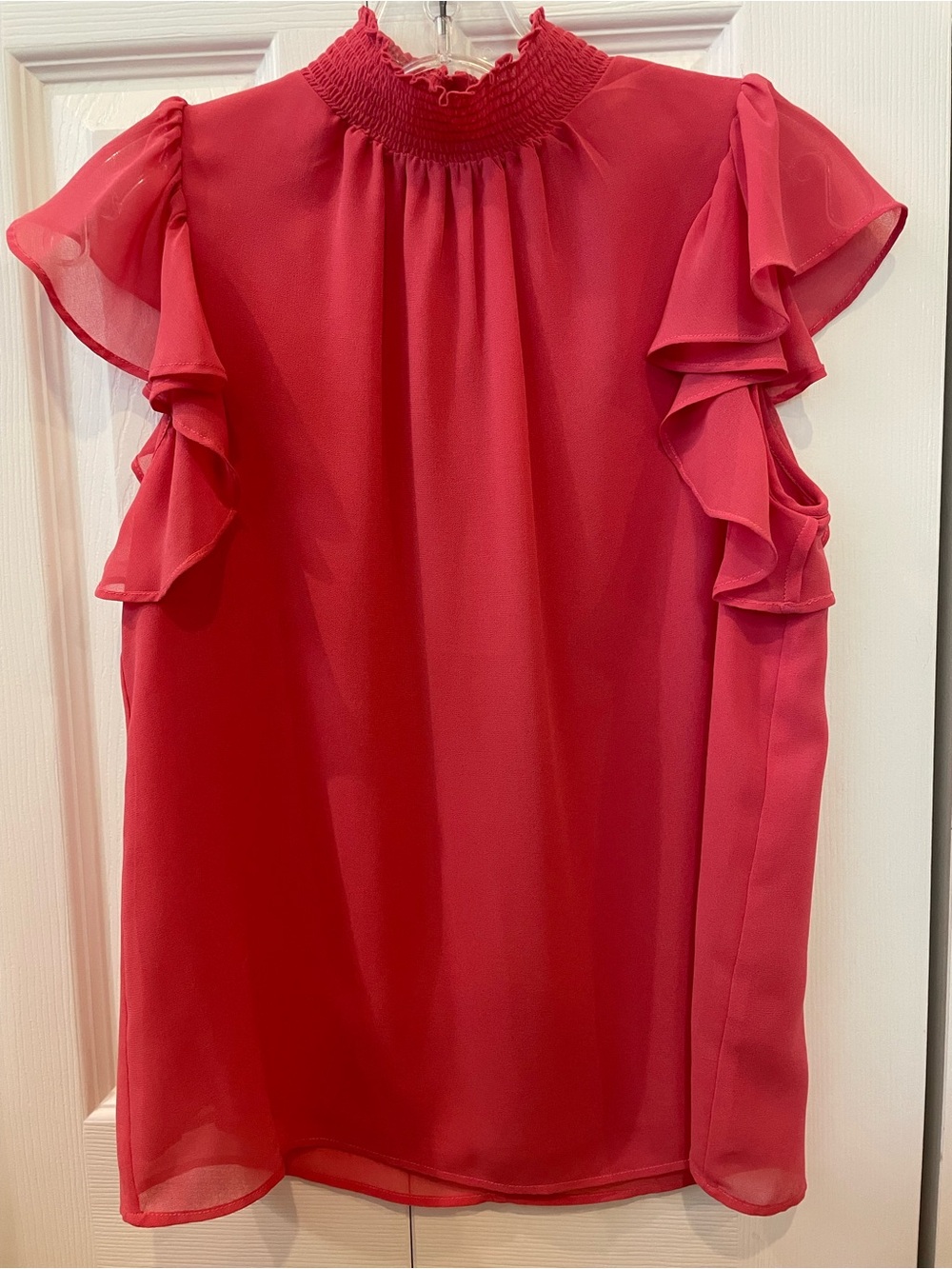1. STATE Coral Poppy colored Flutter Sleeve Smocked Neck Blouse